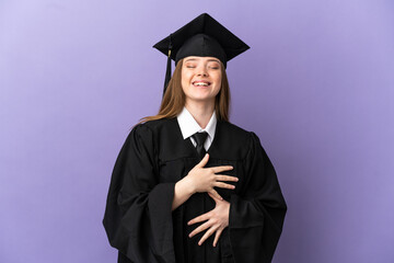 Young university graduate over isolated purple background smiling a lot