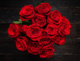 Beautiful red roses with waterdrops. Selective focus. Shallow depth of field.