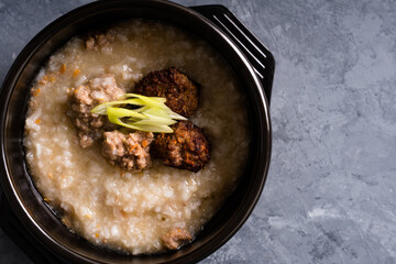delicious boiled ground pork and deep fried pork on congee