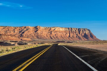 Fototapeta premium A long way down the road going to Glen Canyon National Recreation Area, Arizona