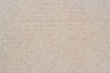 Natural vintage background of organic cardboard with various villi, fluff and other inclusions