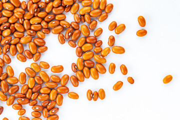 Orange beans on a white background. Space for text.