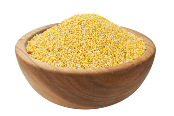 Dry millet in a wooden bowl isolated on white background. Healthy eating vegan food concept.