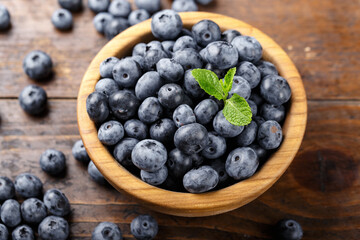 Freshly picked blueberries in a wooden bowl. Healthy berry, organic food, antioxidant, vitamin