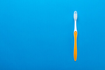 Toothbrushes on a blue background. Concept toothbrush selection. Oral cavity care. Dental hygiene.
