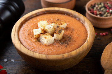 Gazpacho soup on a wooden table.