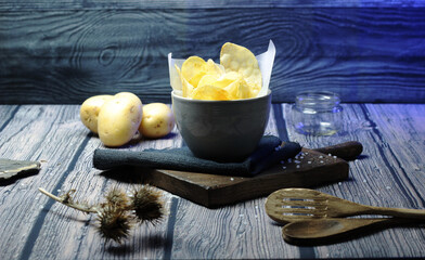 still life bowl of potato chips. Appetizers and snacks. culinary photography rustic and dark