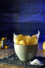 still life bowl of potato chips. Appetizers and snacks. culinary photography rustic and dark