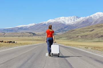 sexy girl in dress with suitcase on the highway, summer travel freedom, woman tourist