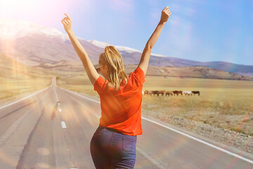 Fototapeta na wymiar girl road hands raised up mountains concept, road freedom active adventure