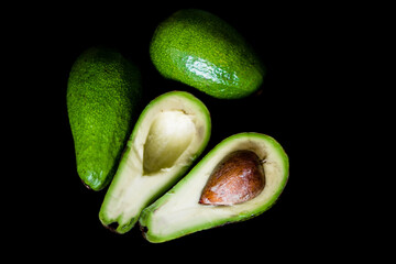 Fresh, raw avocado on a black background