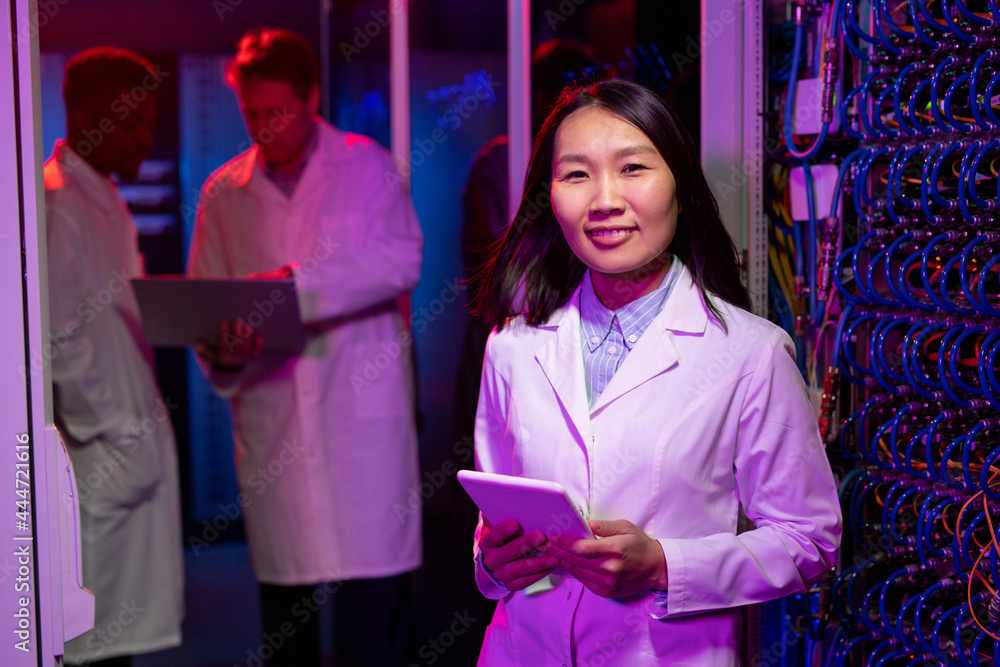Poster smiling asian network engineer