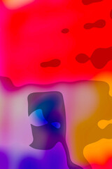 Quirky multi-coloured vertical abstract background in smooth vivid colours with a section suggesting a mechanical face, ready to overlay copy.