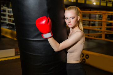 portrait of a young female in boxing gloves 