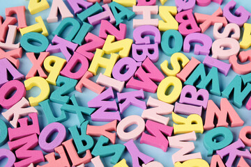 Lots of scattered multicolored letters. Learning to read, alphabet.