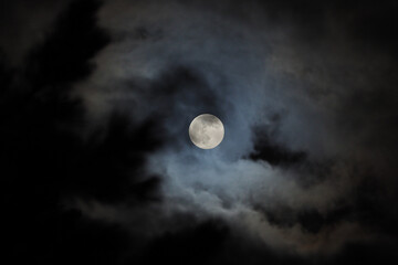 Naklejka na ściany i meble Full moon with clouds behind