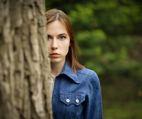 Portrait of beautiful young woman in forest.