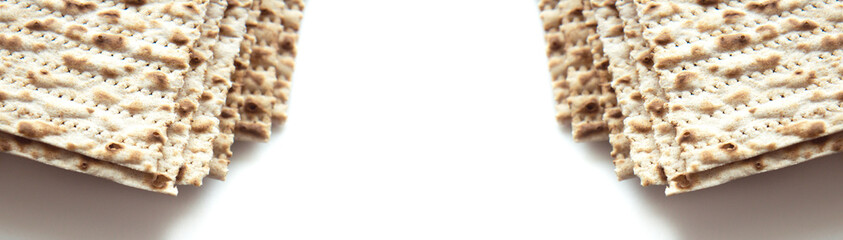 Traditional Jewish kosher matzo for Passover. Set with Passover matzos on white background. Pesach celebration. Banner