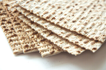 Traditional Jewish kosher matzo for Passover. Set with Passover matzos on white background. Pesach celebration