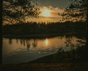 Red sunset sky over the river Katun. Altai. Russia