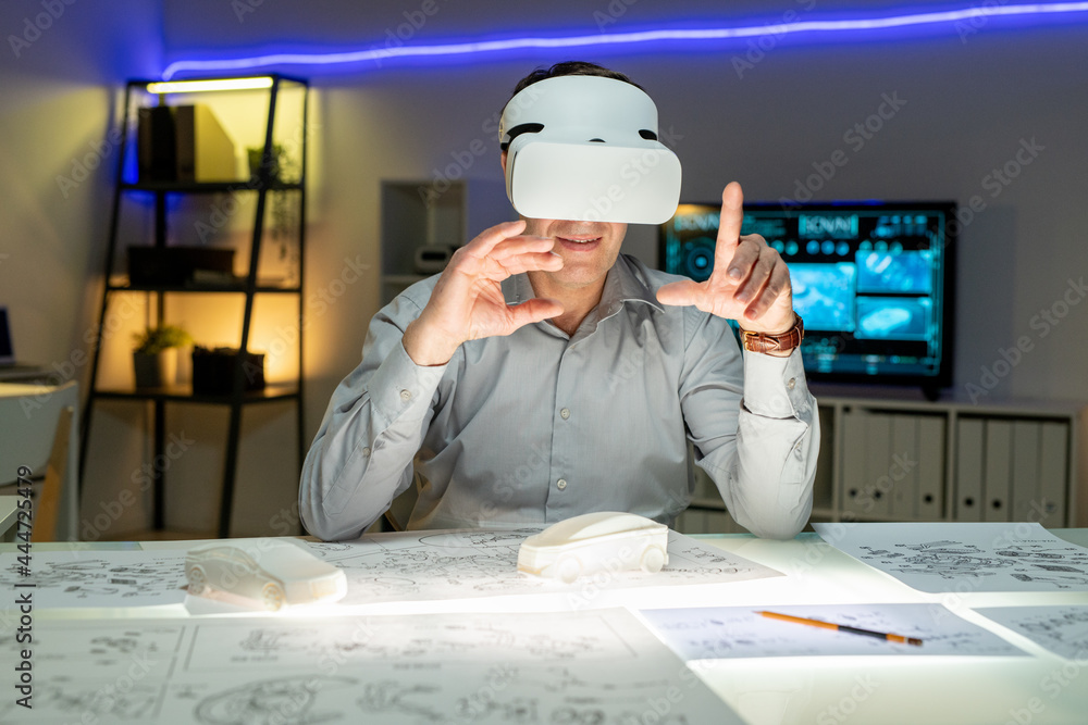 Poster innovative designer in vr headset working with interactive maquette