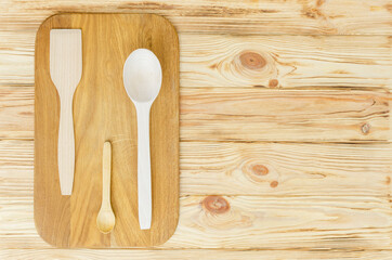 Top view of various wooden kitchen utensils on table top