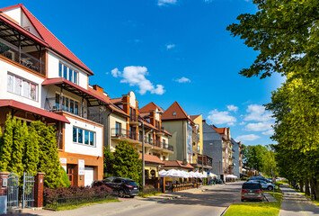 Panoramic view of lake promenade ulica Pulaskiego street with tourist pensions and restaurants along Jezioro Elckie lake shore in Elk town in Masuria region of Poland
