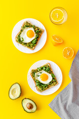 Sadwich with avocado eggs and spinach on toasted bread