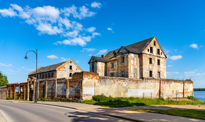 Fototapeta na wymiar Ruins of historic Elk castle of Teutonic Order - Zamek w Elku - at Zamkowa street on shore of Jezioro Elckie lake in Masuria region of Poland