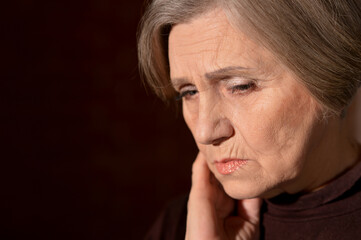 Close up portrait of sad senior woman