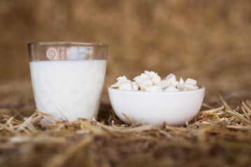 milk and cottage cheese on hay