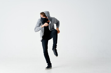 man hiding face in mask hooded sneaking stealing isolated background