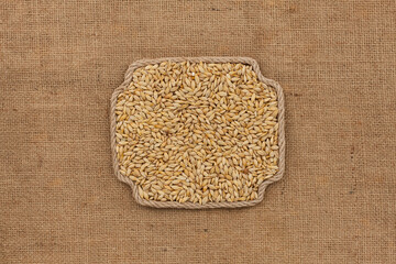 Frame made of rope with a whole, ripe barley grain. With space for design, text place