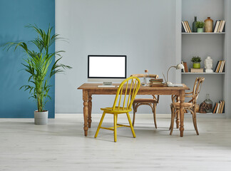Decorative wooden furniture office room with computer and laptop style, retro cabinet and shelf background, blue and grey wall interior concept.