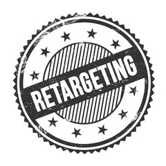 RETARGETING text written on black grungy round stamp.