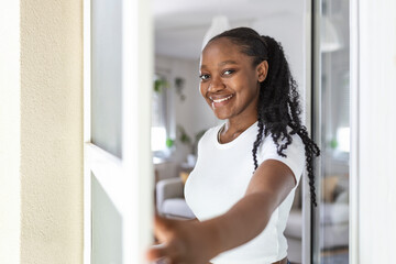 Woman hand hold retractable pleated insect screen holder to open or close the balcony door,mosquito nets © Graphicroyalty