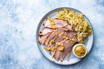 Bavarian pork knuckle with sauerkraut with mustard
