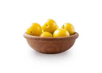 Heap of plums isolated on white background. Yellow plums with copy space for text. Plums in wooden bowl on white background. Fresh summer fruits.
