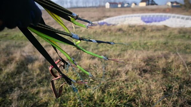 Close-up of a paraglider harness and gear.