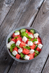 Summer salad with watermelon, mint, cucumber and feta cheese close up