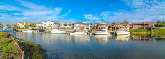 Estates at Huntington Beach, Southern California with yachts - obrazy, fototapety, plakaty