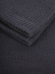 the edge of multi-colored socks, curved sleeves, several layers of fabric