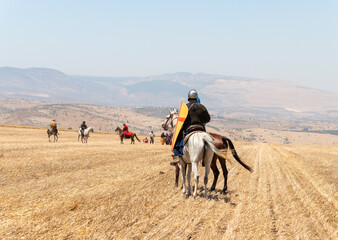 Horse and foot warriors - participants in the reconstruction of Horns of Hattin battle in 1187, are on the battle site, near TIberias, Israel