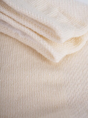 Fototapeta na wymiar the edge of multi-colored socks, curved sleeves, several layers of fabric