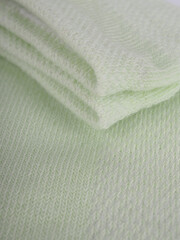 Fototapeta na wymiar the edge of multi-colored socks, curved sleeves, several layers of fabric