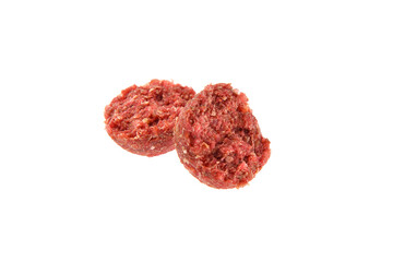 Close up view of broken red boilies, fishing baits for carp isolated on white background