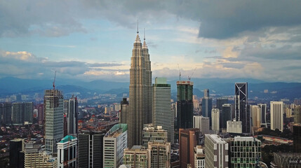 Fototapeta premium Aerial view of Kuala Lumpur cityscape. Photo from a drone of Asian skyscrapers.