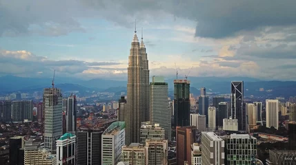Fotobehang Aerial view of Kuala Lumpur cityscape. Photo from a drone of Asian skyscrapers. © skymediapro