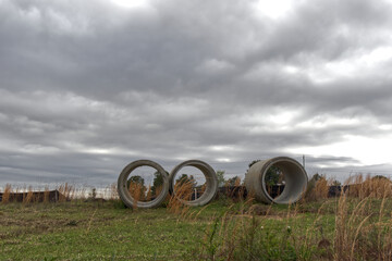 Round concrete sewage tunnels at a construction site