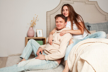 young caucasian pregnant couple together at home relaxing in bed, lifestyle people concept